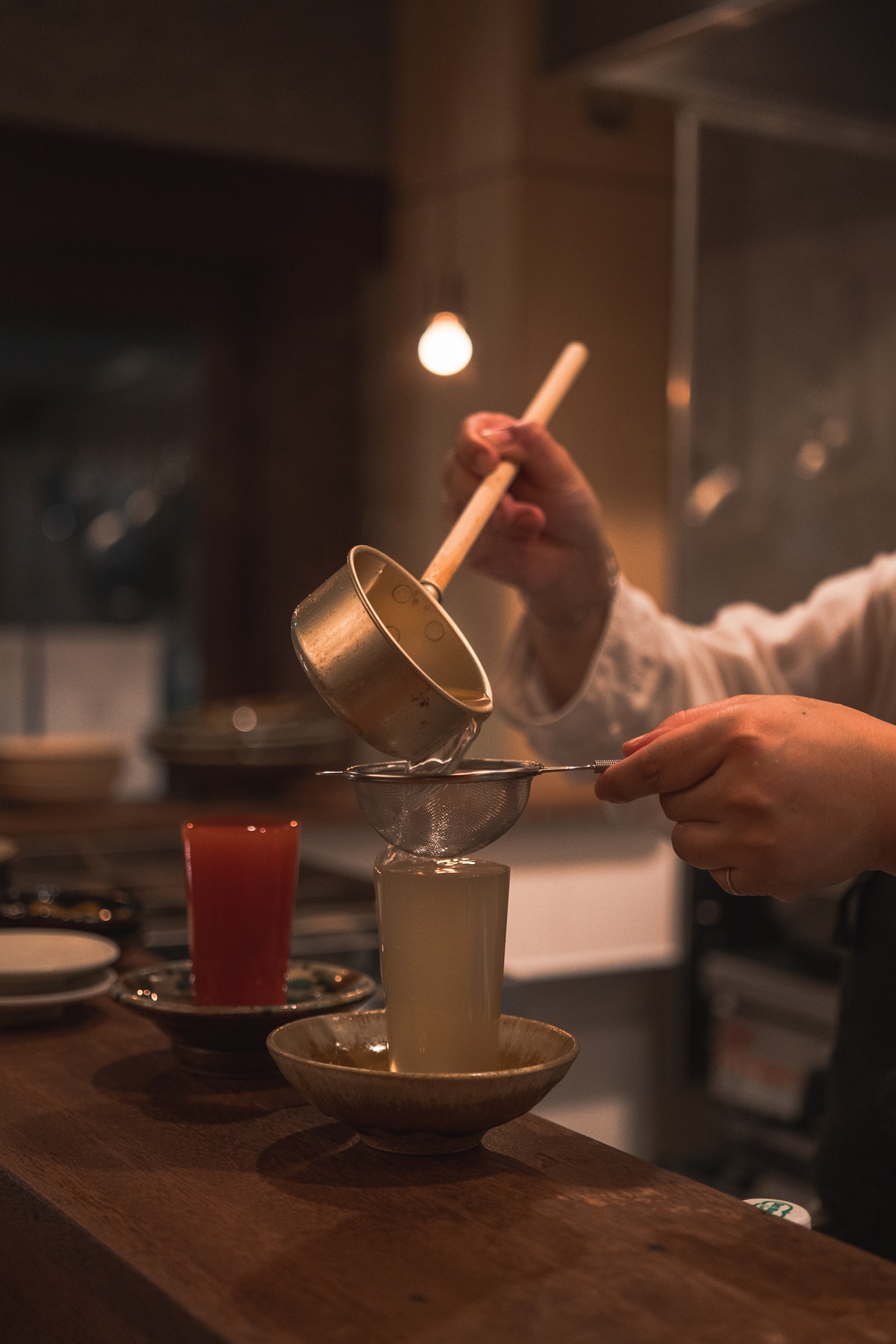 貝出汁を焼酎で割った一杯
